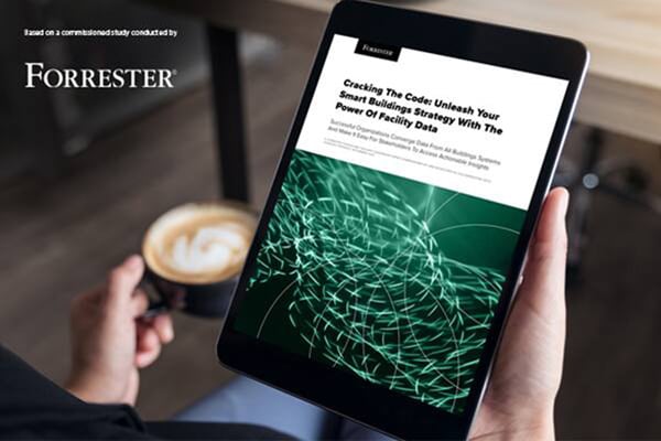Close-up of a hand holding the tab displaying the forrester report