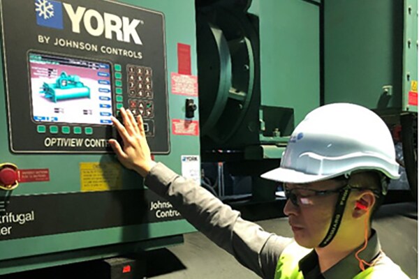 Engineer operating an interface by Johnson Controls