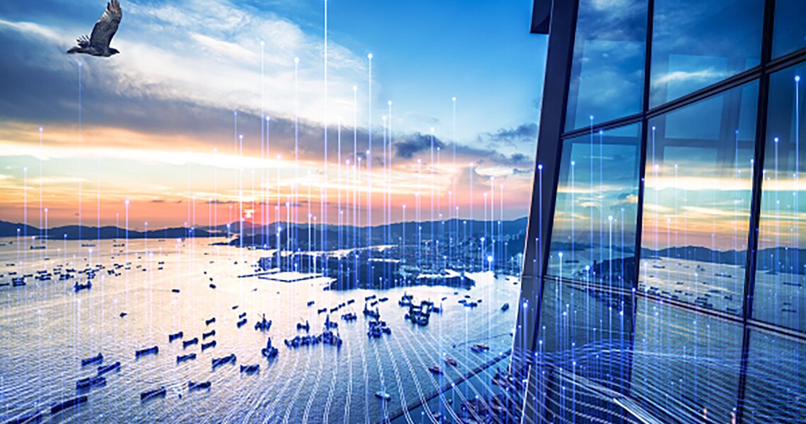 Aerial view of a sea coast in the evening overlaid with graphics of transmission of nodes