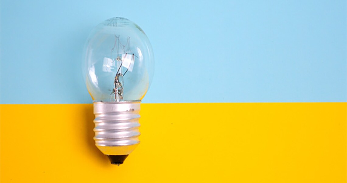 Close up of a bulb with yellow and blue background