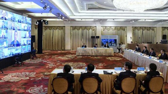 Employees participating in a meeting in the conference room