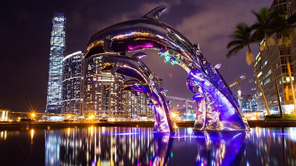 Evening view of sky scrappers with dolphin fountain
