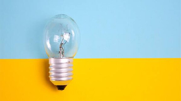 Close up of a bulb with yellow and blue background