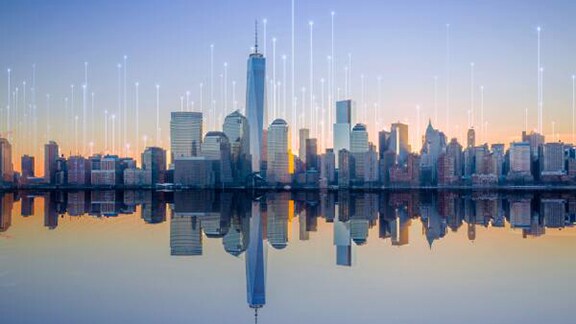 Reflection of the city scrappers on the water overlaid with graphics of transmission of nodes