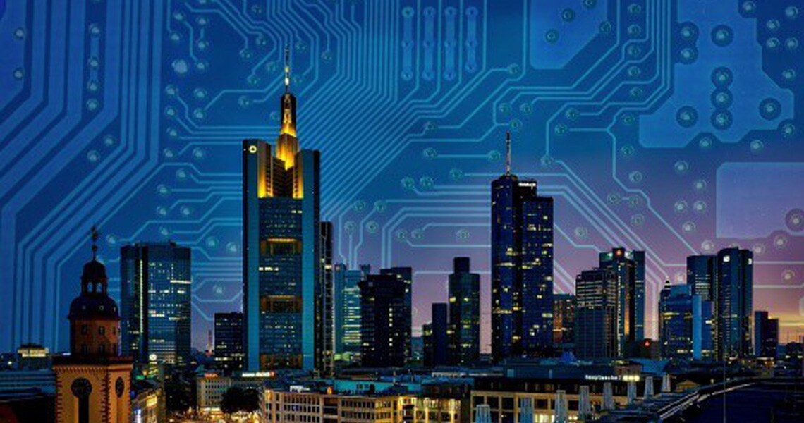 View of a cityscape in the night overlaid with electric circuit grid in the background