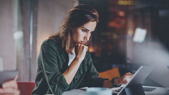 A women employee at work sitting in a office space