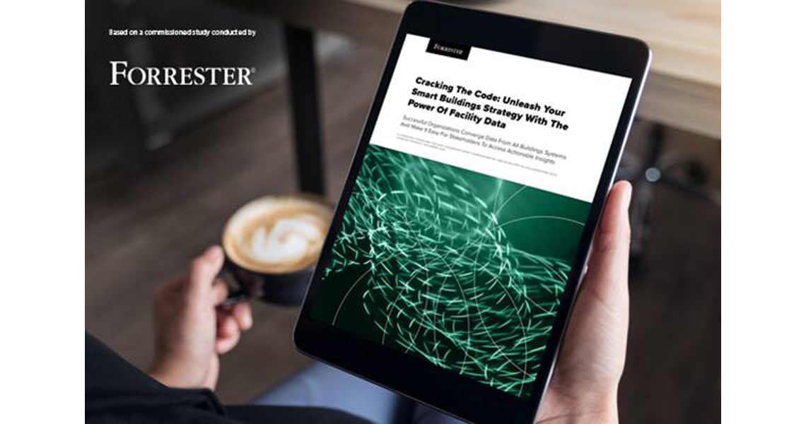 Close-up of a hand holding the tab displaying the forrester report