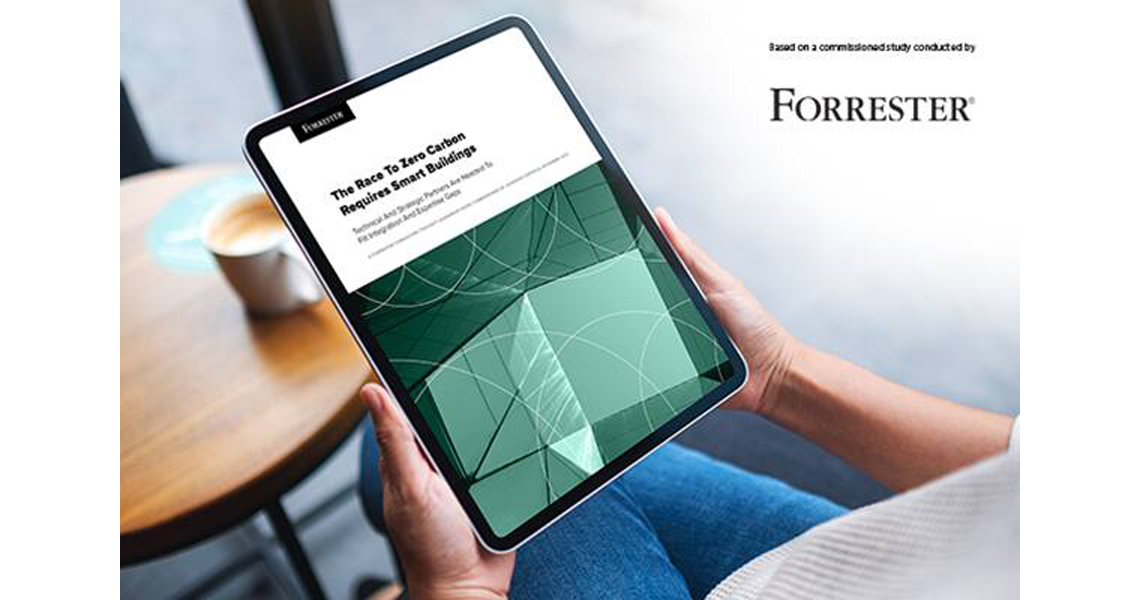 Close-up of a hand holding the tab displaying the forrester report
