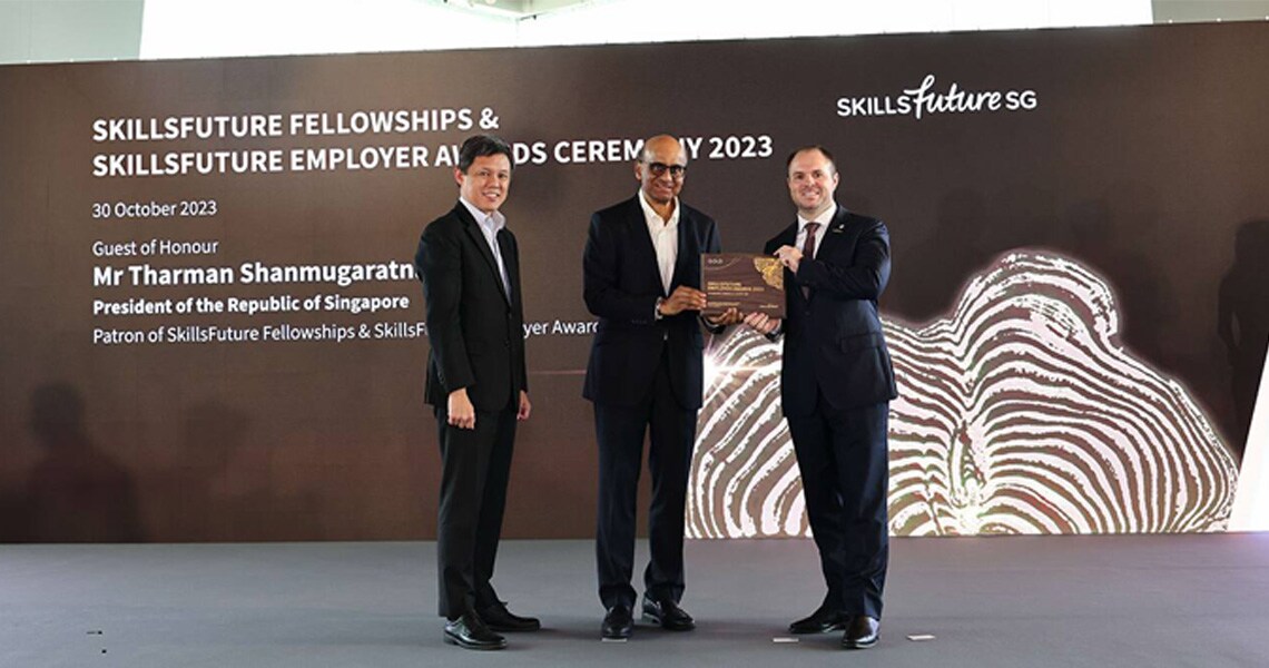 Roy Ee, Director (Integrated Facilities Management), ENGIE Services Singapore receiving SkillsFuture Fellowships presented by President Tharman Shanmugaratnam.