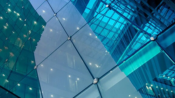 Close-up of a modern building with a glass facade