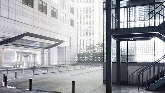 Exterior of a modern building with a visible exterior staircase