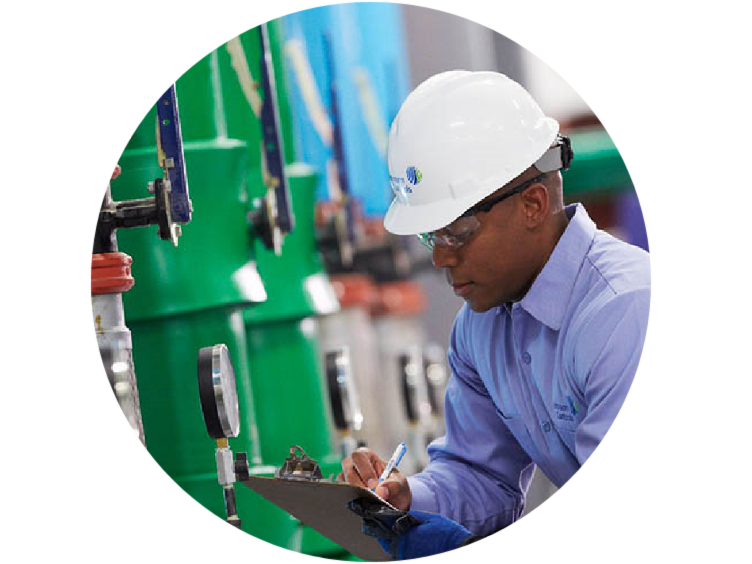 Close-up of an technician from Johnson Controls inspecting equipment
