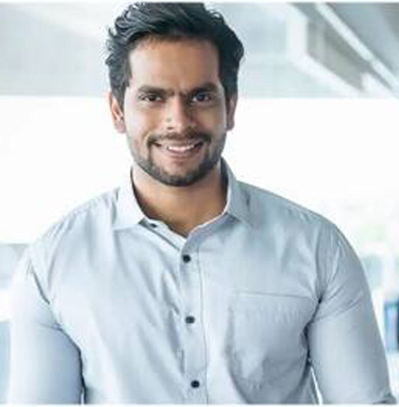 Close up of a smiling employee in formal on the office floor