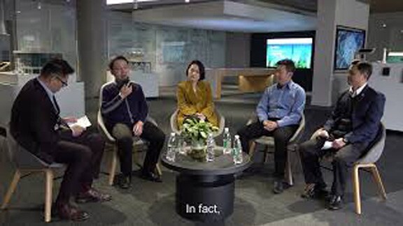 Five professional people gathered for a panel discussion