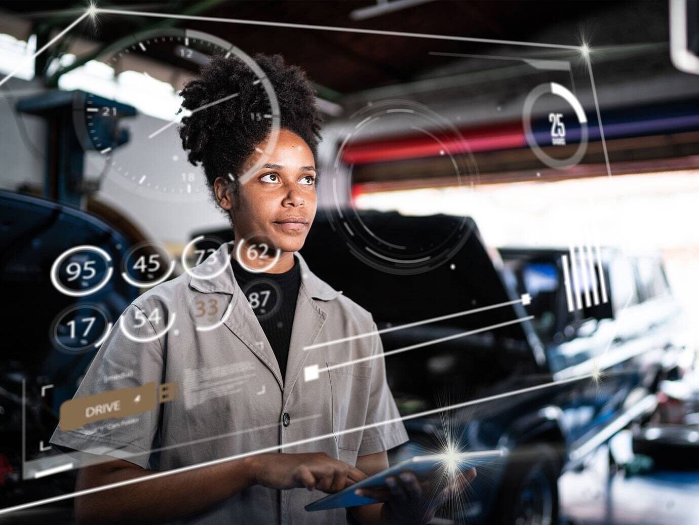 A female mechanic in an auto repair shop with augmented reality (AR)