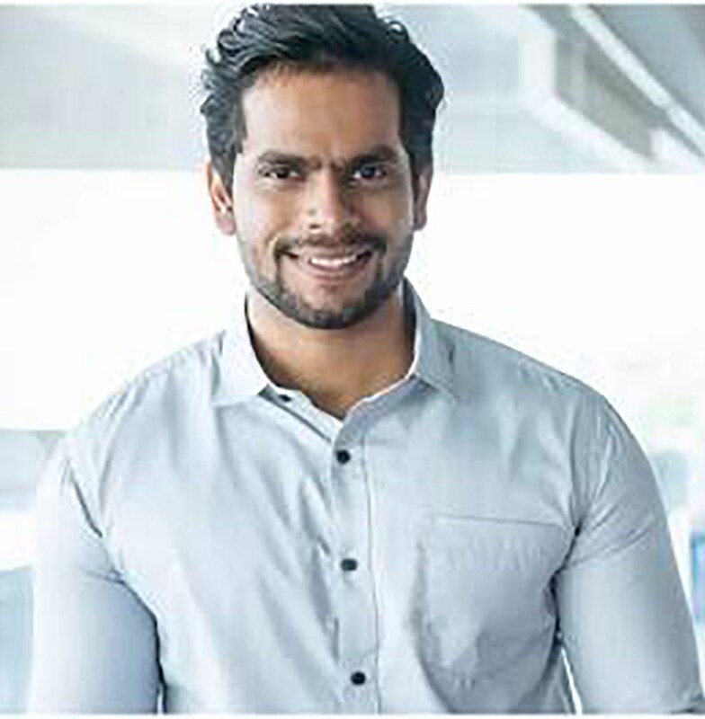 Close-up of a man holding a tablet in the office space