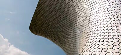 Close-up of distinctive honeycomb-patterned facade of the Museo Soumaya in Mexico City, Mexico