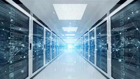 A long hallway lined with servers and data lines