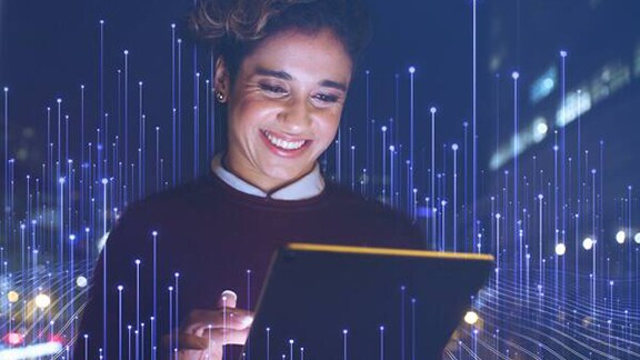 An woman using a tab with openblue background
