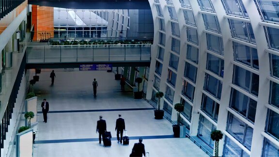 Interior motion picture of people walking in the Airport  terminal