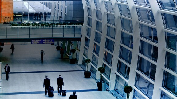 People walking inside an airport terminal