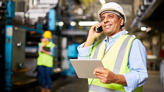 Contractor safety gear speaking phone