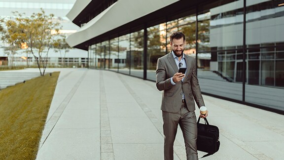 Man carrying messenger bag walking