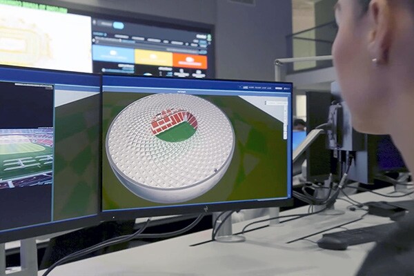 Woman looking at Multiple Screens