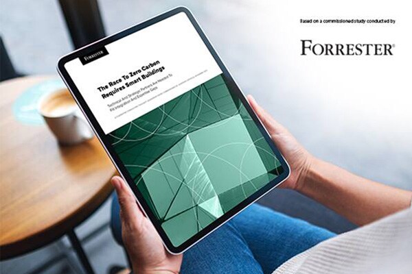 Close-up of a hand holding the tab displaying the forrester report